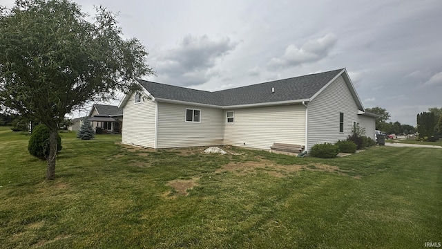 1237 Northstone Rd, Goshen, IN 46526 - rear view of property featuring a lawn and roof with shingles