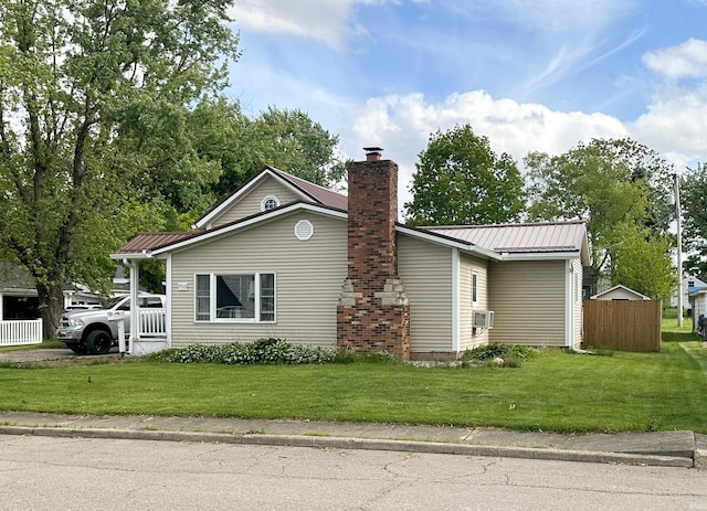 753 W Centennial St, Nappanee, IN 46550 - view of side of property with a chimney, metal roof, and cooling unit