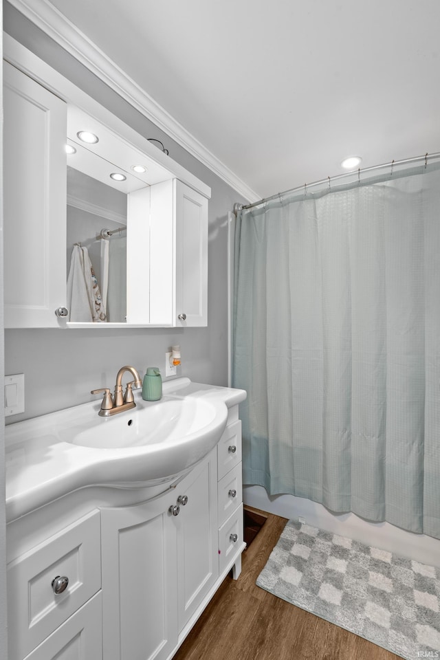 753 W Centennial St, Nappanee, IN 46550 - bathroom featuring ornamental molding, vanity, wood finished floors, recessed lighting, and shower / bath combo