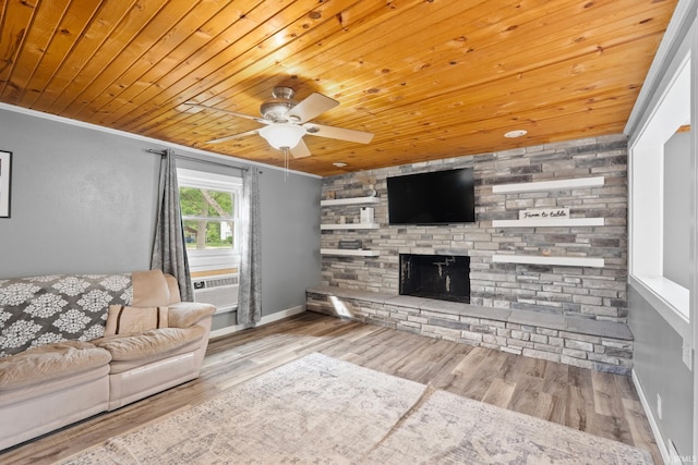 753 W Centennial St, Nappanee, IN 46550 - living room featuring ceiling fan, wooden ceiling, a stone fireplace, crown molding, and wood finished floors