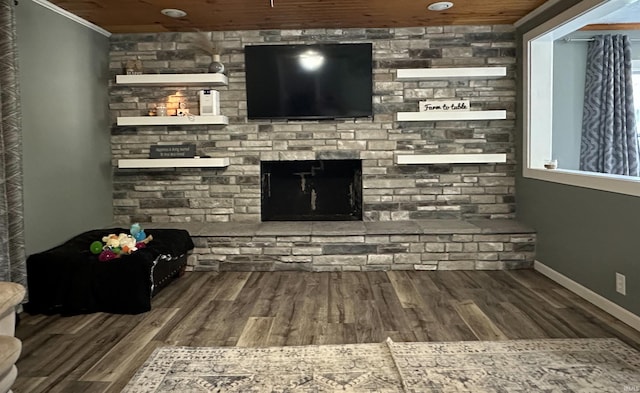 753 W Centennial St, Nappanee, IN 46550 - unfurnished living room featuring wood finished floors, a fireplace, baseboards, and crown molding