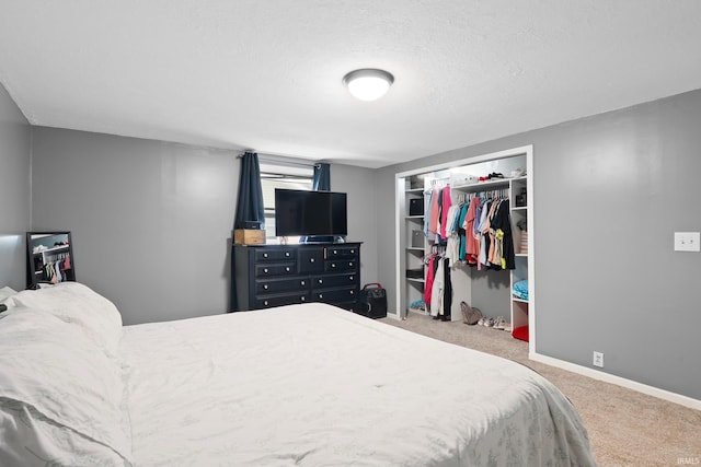 753 W Centennial St, Nappanee, IN 46550 - carpeted bedroom featuring a closet, baseboards, and a textured ceiling
