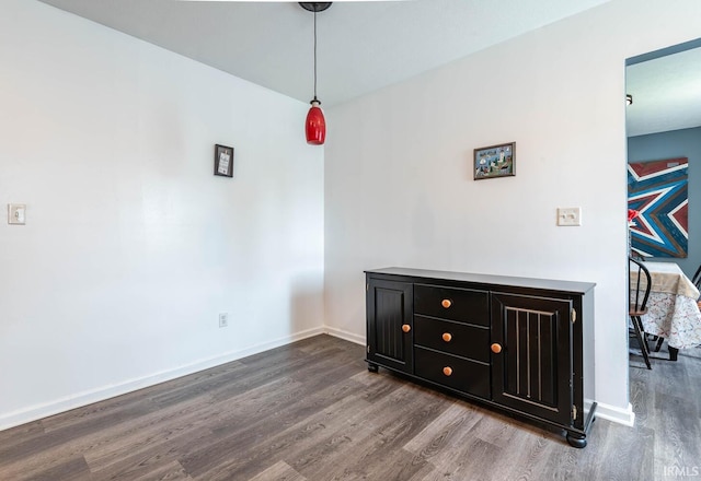 7203 W Capstone Cir, Bloomington, IN 47404 - unfurnished dining area featuring wood finished floors and baseboards