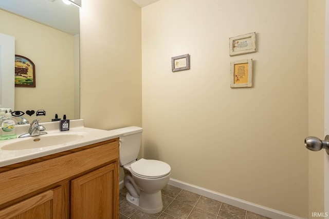 7203 W Capstone Cir, Bloomington, IN 47404 - bathroom with toilet, vanity, tile patterned flooring, and baseboards