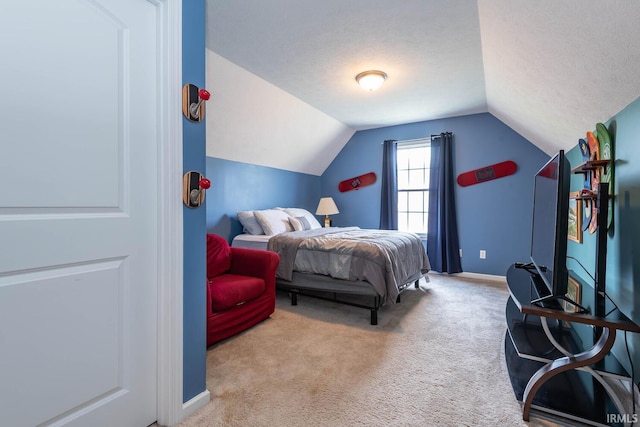 7203 W Capstone Cir, Bloomington, IN 47404 - carpeted bedroom with vaulted ceiling and baseboards