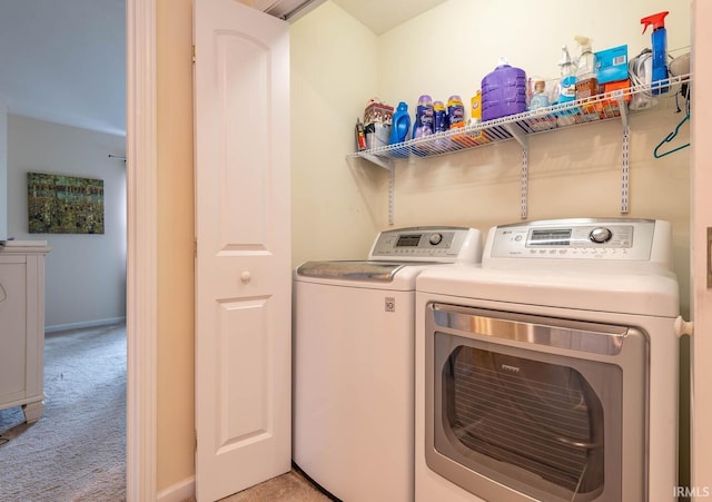 7203 W Capstone Cir, Bloomington, IN 47404 - laundry room featuring independent washer and dryer, light carpet, and baseboards