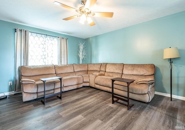 7203 W Capstone Cir, Bloomington, IN 47404 - living area with a ceiling fan, wood finished floors, and baseboards