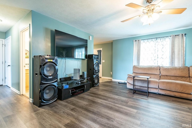 7203 W Capstone Cir, Bloomington, IN 47404 - living room with wood finished floors, a ceiling fan, and baseboards