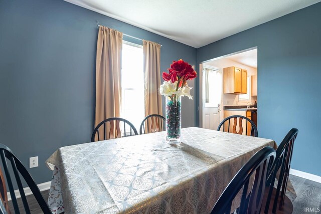 7203 W Capstone Cir, Bloomington, IN 47404 - dining space featuring wood finished floors and baseboards