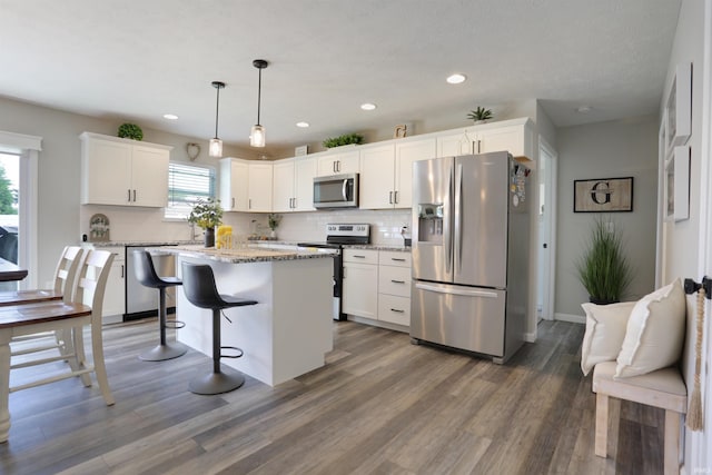 606 W Elm St, Haubstadt, IN 47639 - kitchen featuring appliances with stainless steel finishes, decorative backsplash, white cabinetry, and recessed lighting