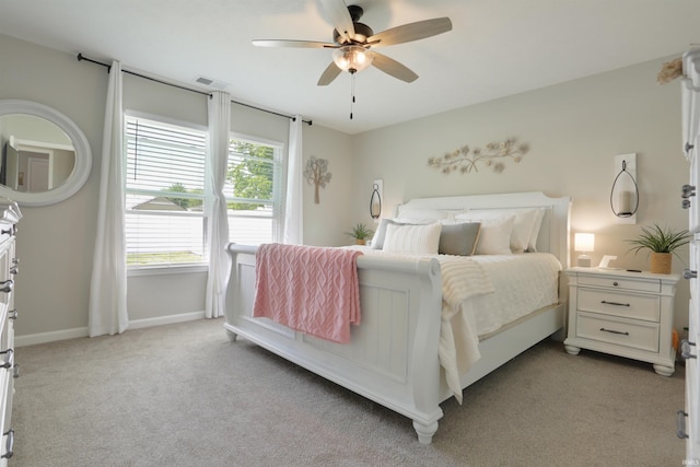 606 W Elm St, Haubstadt, IN 47639 - carpeted bedroom with ceiling fan and baseboards