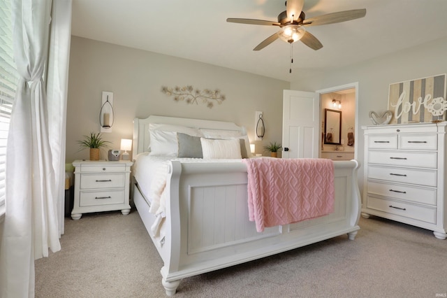 606 W Elm St, Haubstadt, IN 47639 - bedroom featuring light carpet, ensuite bath, and a ceiling fan