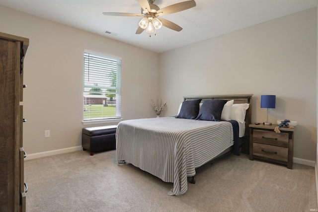 606 W Elm St, Haubstadt, IN 47639 - bedroom with light colored carpet, baseboards, and ceiling fan