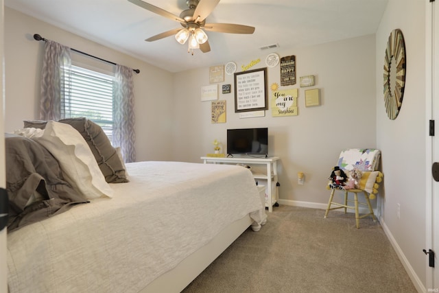 606 W Elm St, Haubstadt, IN 47639 - bedroom featuring baseboards, a ceiling fan, and carpet