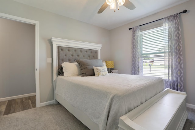 606 W Elm St, Haubstadt, IN 47639 - carpeted bedroom with baseboards and a ceiling fan