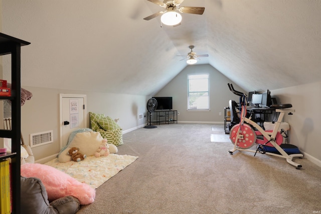 606 W Elm St, Haubstadt, IN 47639 - exercise room with a ceiling fan, carpet flooring, vaulted ceiling, and baseboards