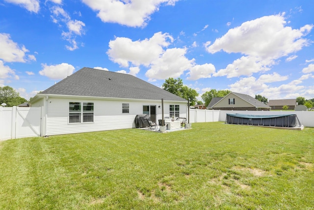 606 W Elm St, Haubstadt, IN 47639 - rear view of property with a pool, a patio, roof with shingles, and a gate