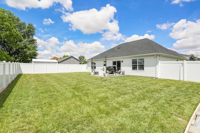 606 W Elm St, Haubstadt, IN 47639 - rear view of property with a patio and roof with shingles
