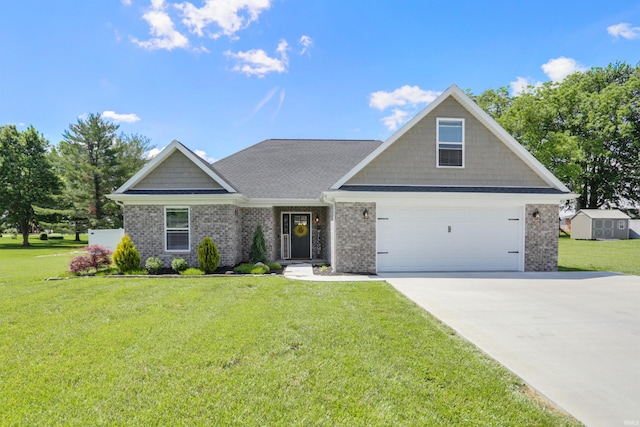 606 W Elm St, Haubstadt, IN 47639 - view of front of property featuring brick siding, a front yard, concrete driveway, and a garage