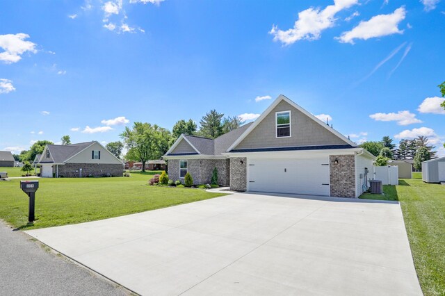 606 W Elm St, Haubstadt, IN 47639 - view of front of home with a front lawn, concrete driveway, brick siding, and central AC unit