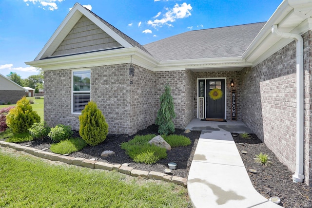606 W Elm St, Haubstadt, IN 47639 - property entrance with brick siding and a shingled roof