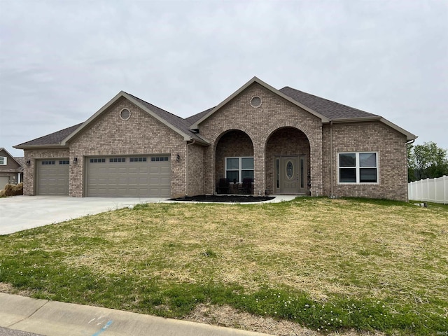 7815 Jt Ct, Evansville, IN 47715 - view of front facade featuring brick siding, a garage, concrete driveway, and roof with shingles