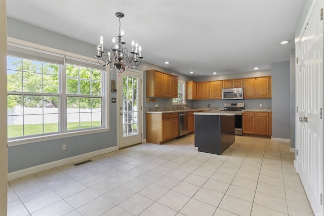 3746 Rolling Rock Dr, Evansville, IN 47711 - kitchen with appliances with stainless steel finishes, a chandelier, a sink, plenty of natural light, and recessed lighting