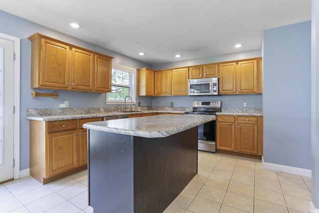 3746 Rolling Rock Dr, Evansville, IN 47711 - kitchen with stainless steel appliances, a sink, light tile patterned flooring, a kitchen island, and recessed lighting