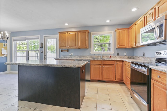 3746 Rolling Rock Dr, Evansville, IN 47711 - kitchen featuring stainless steel appliances, a sink, healthy amount of natural light, a center island, and recessed lighting