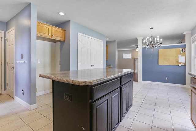 3746 Rolling Rock Dr, Evansville, IN 47711 - kitchen with light tile patterned floors, a ceiling fan, a center island, a chandelier, and recessed lighting