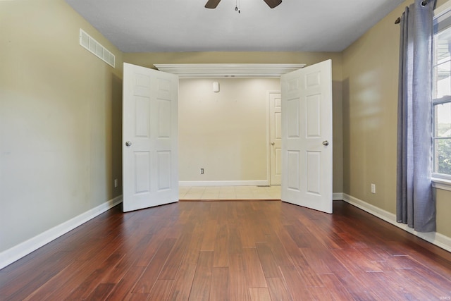 3746 Rolling Rock Dr, Evansville, IN 47711 - unfurnished bedroom featuring wood finished floors, baseboards, and ceiling fan