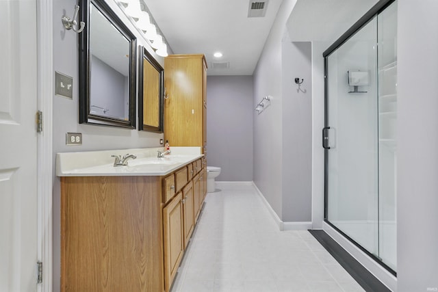 3746 Rolling Rock Dr, Evansville, IN 47711 - bathroom featuring double vanity, a shower stall, toilet, baseboards, and recessed lighting