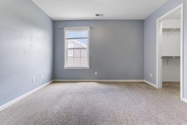 3746 Rolling Rock Dr, Evansville, IN 47711 - unfurnished bedroom with a spacious closet, carpet, and a closet
