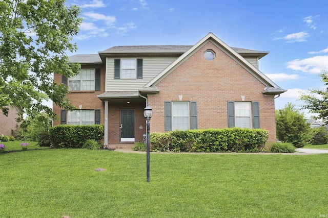 3746 Rolling Rock Dr, Evansville, IN 47711 - traditional-style house featuring a front yard and brick siding