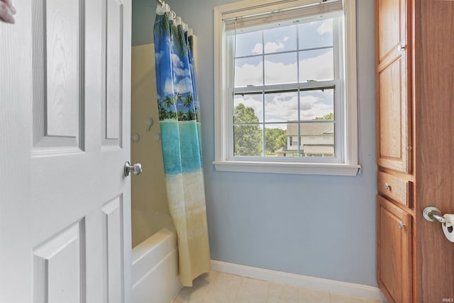 3746 Rolling Rock Dr, Evansville, IN 47711 - full bath with baseboards, tile patterned flooring, and shower / bath combination with curtain