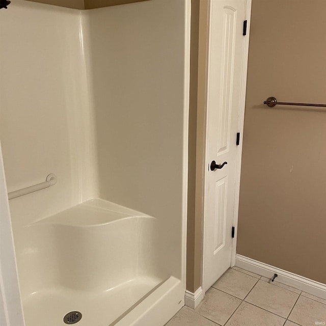 1841 S Patriot Dr, Yorktown, IN 47396 - bathroom featuring tile patterned flooring, baseboards, and a shower