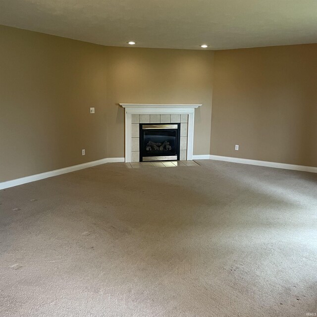 1841 S Patriot Dr, Yorktown, IN 47396 - unfurnished living room featuring a tile fireplace, carpet flooring, recessed lighting, and baseboards