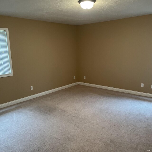 1841 S Patriot Dr, Yorktown, IN 47396 - unfurnished room with carpet floors, baseboards, and a textured ceiling