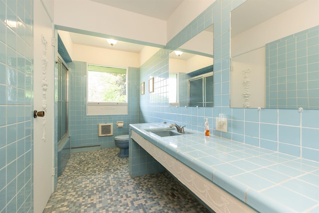 16128 Chandler Blvd, Mishawaka, IN 46544 - full bathroom with toilet, vanity, tile walls, and shower / bath combination with glass door