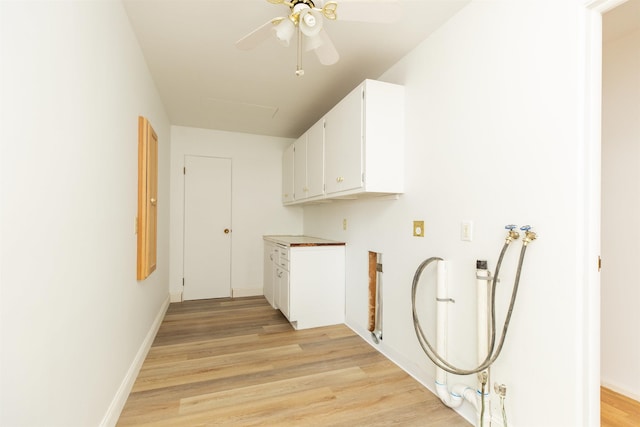 16128 Chandler Blvd, Mishawaka, IN 46544 - laundry room with cabinet space, washer hookup, light wood-type flooring, ceiling fan, and baseboards