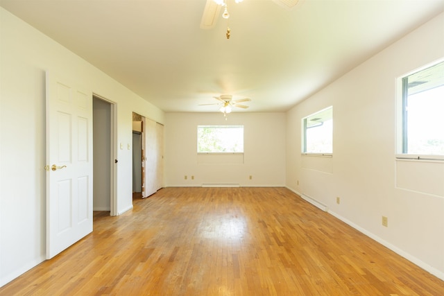 16128 Chandler Blvd, Mishawaka, IN 46544 - empty room with a ceiling fan, light wood-style flooring, a baseboard radiator, and baseboards