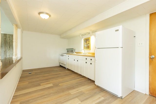 16128 Chandler Blvd, Mishawaka, IN 46544 - kitchen with freestanding refrigerator, light wood-style floors, and white cabinetry