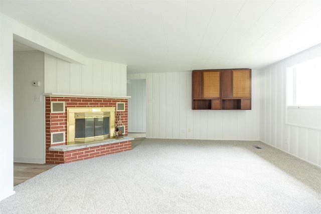 16128 Chandler Blvd, Mishawaka, IN 46544 - unfurnished living room featuring carpet floors and a brick fireplace