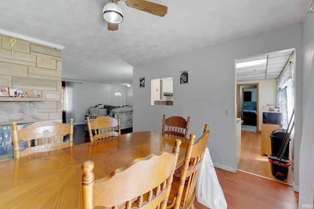 4893 Woodway Dr, Fort Wayne, IN 46835 - dining room with wood finished floors, a ceiling fan, and baseboards