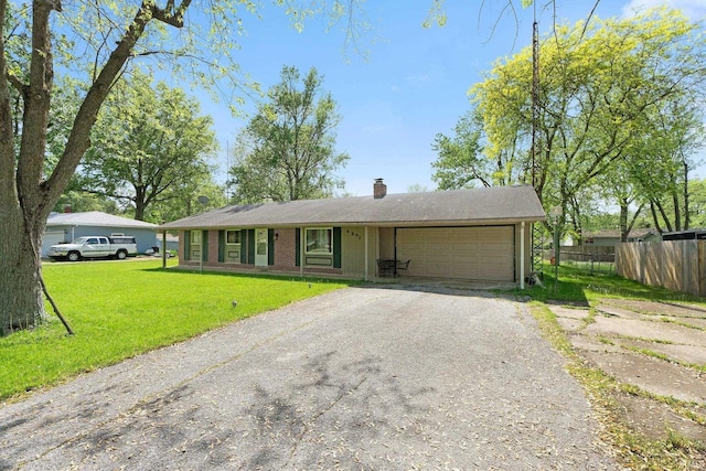 4893 Woodway Dr, Fort Wayne, IN 46835 - ranch-style home with an attached garage, asphalt driveway, and a chimney