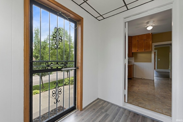 3550 Sandpoint Rd, Fort Wayne, IN 46809 - doorway featuring a wainscoted wall and wood finished floors