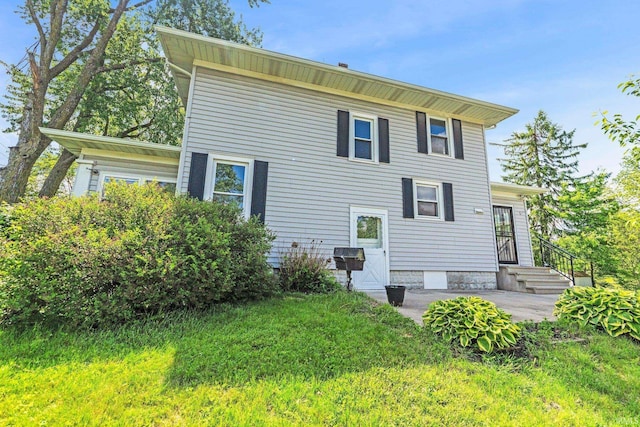 3550 Sandpoint Rd, Fort Wayne, IN 46809 - rear view of house with a lawn and a patio area