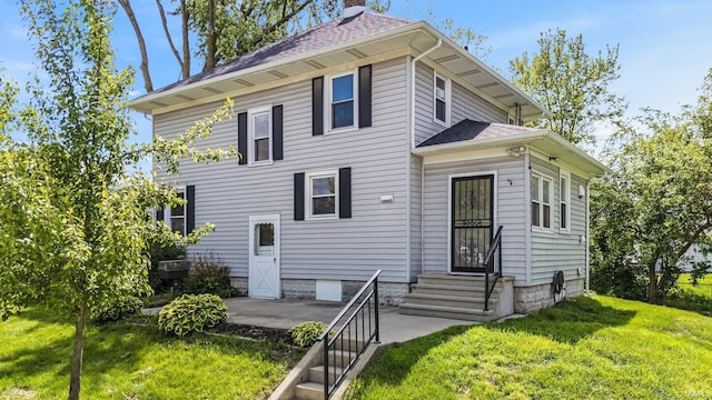 3550 Sandpoint Rd, Fort Wayne, IN 46809 - traditional style home with entry steps, a front yard, a patio area, a chimney, and a shingled roof