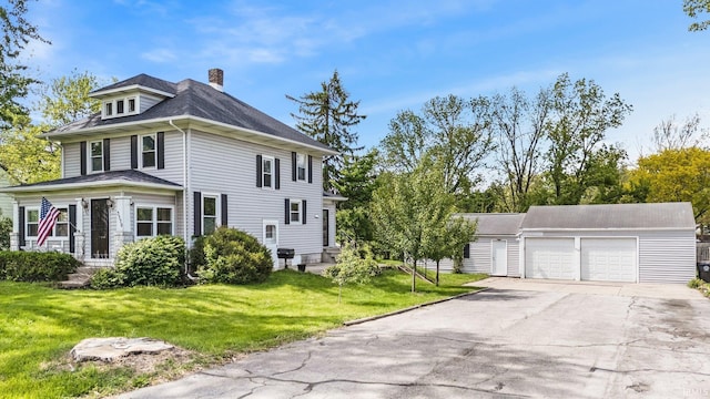 3550 Sandpoint Rd, Fort Wayne, IN 46809 - view of side of property with an outdoor structure, a chimney, a yard, and roof with shingles