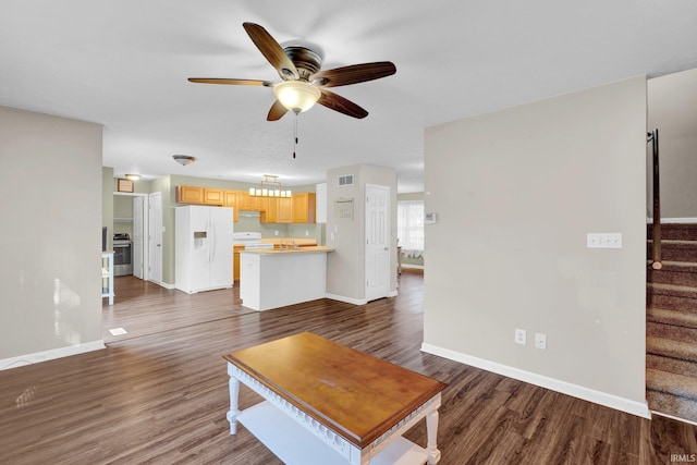 325 W Persimmon Ct, Bloomington, IN 47403 - living room featuring a ceiling fan, stairway, baseboards, and dark wood-style floors